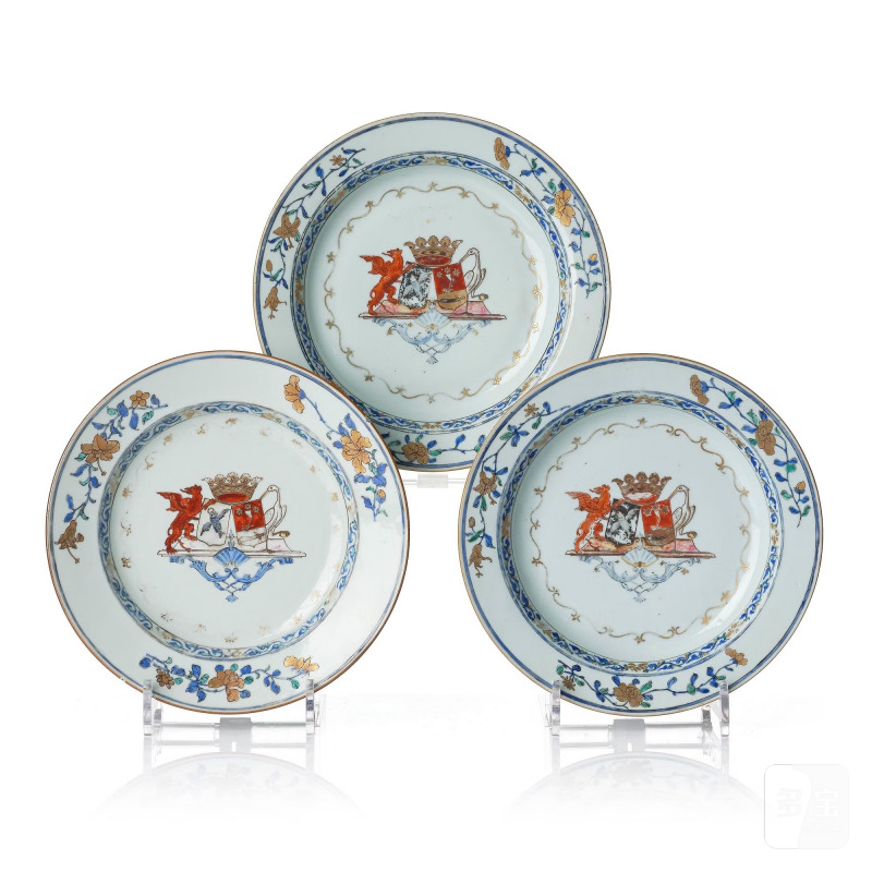 A set of the three famille rose armorial dinner plates,